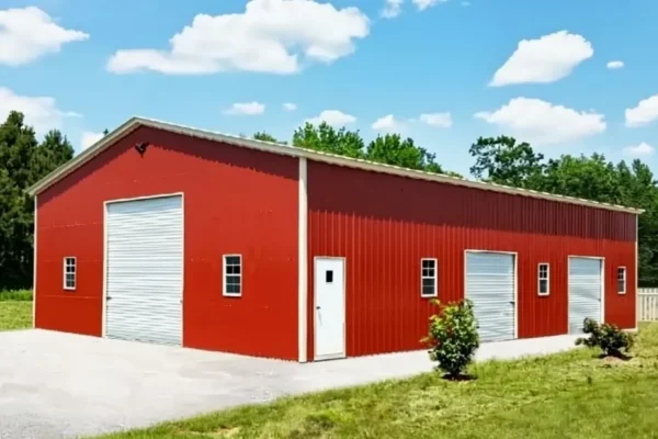 40x60 metal garage with red siding and white trim